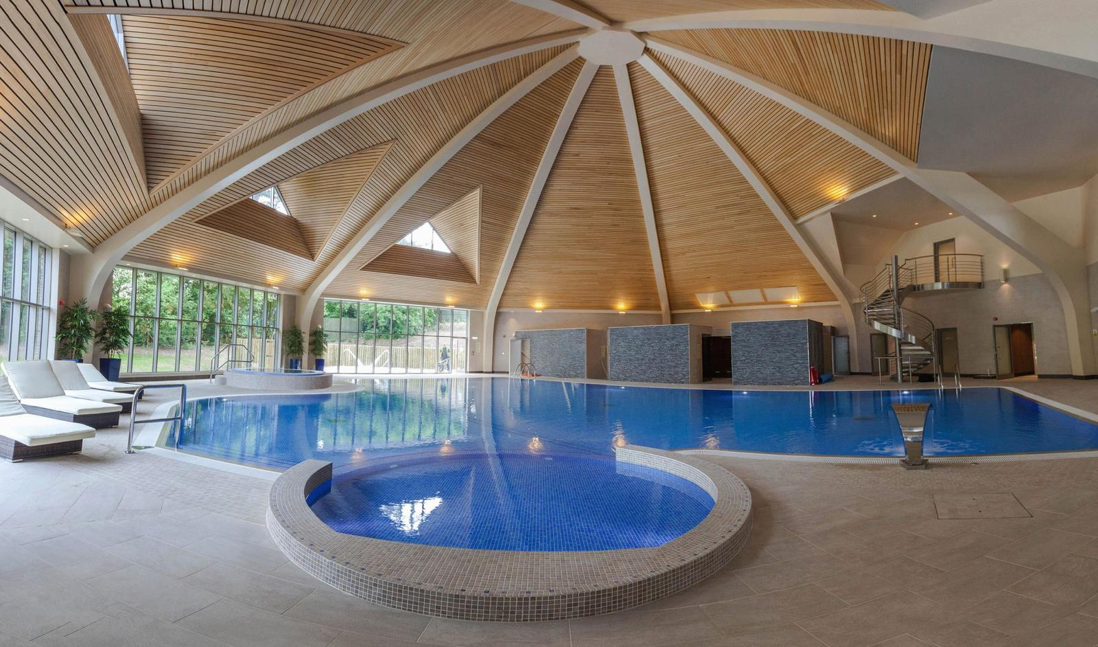 Vaulted timber roof over an indoor pool hall designed and built by East Midlands Architecture