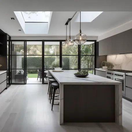 Finished open-plan kitchen and dining extension with black framed glazing, a roof lantern and a large island